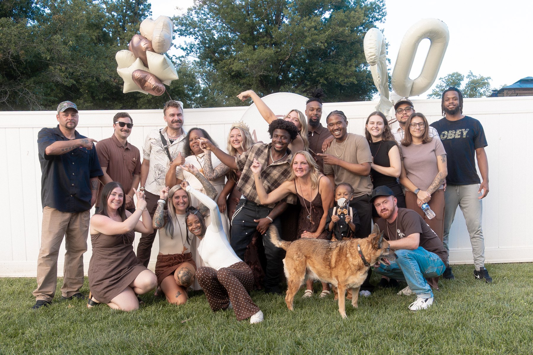 Family and friends gathered outside with Alysa for a birthday group photograph
