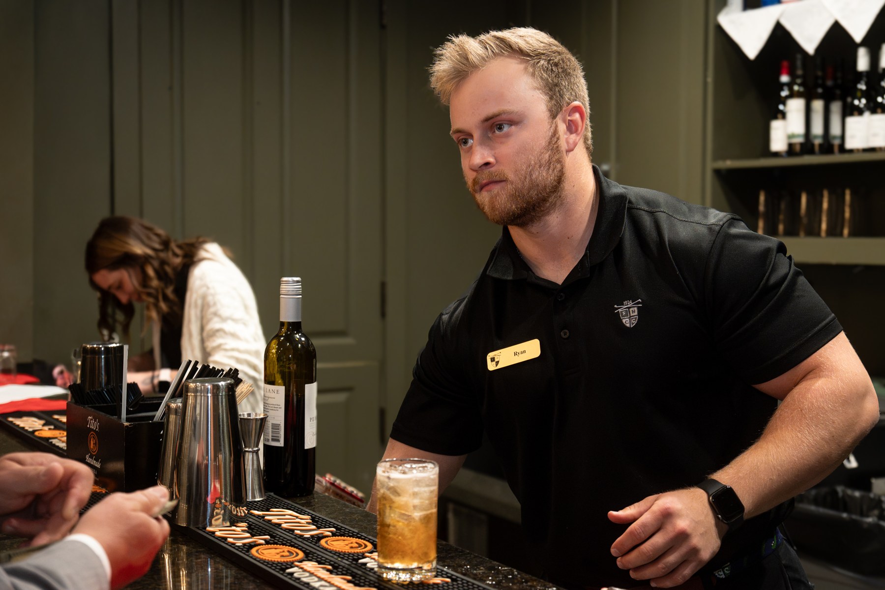 A bartender serving guests at the Washington County Chamber Annual Meeting