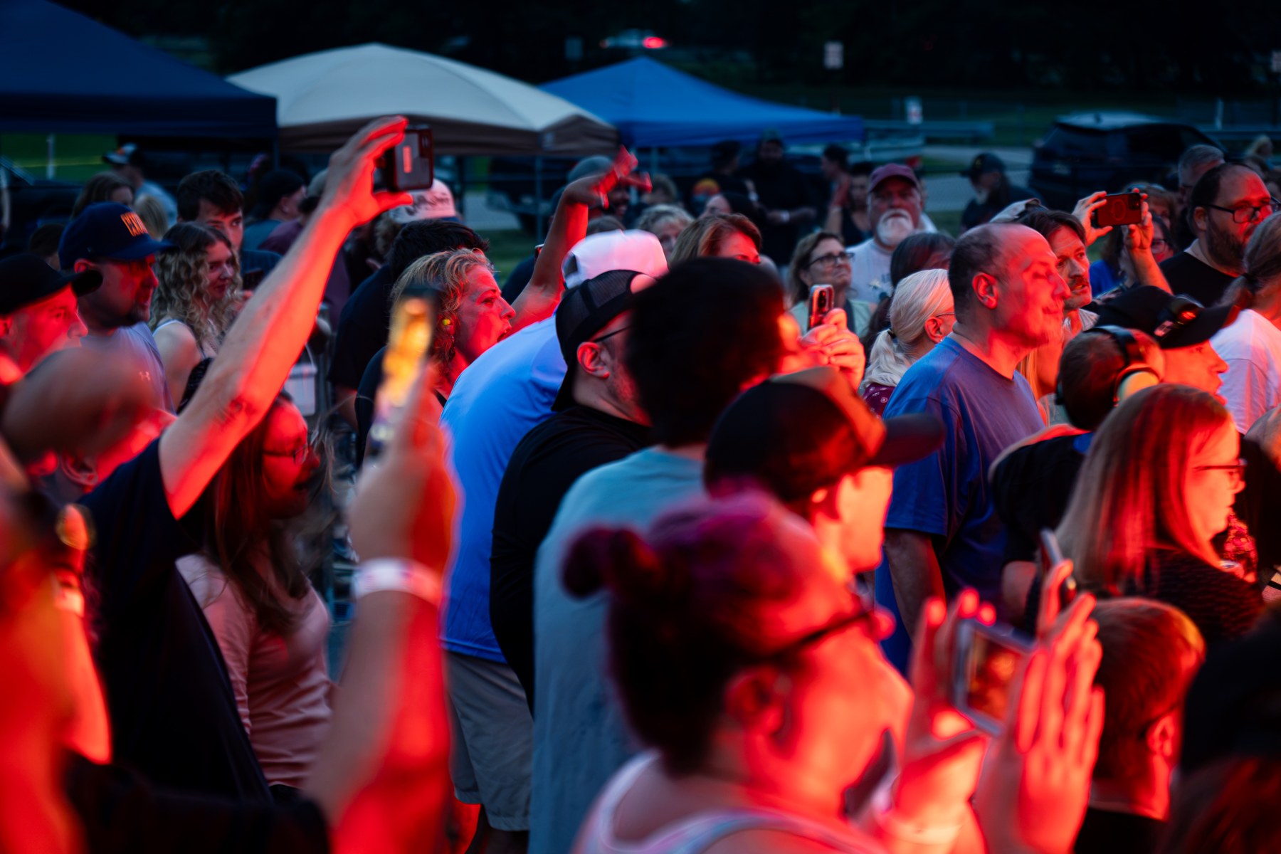 A festival audience gathered outdoors